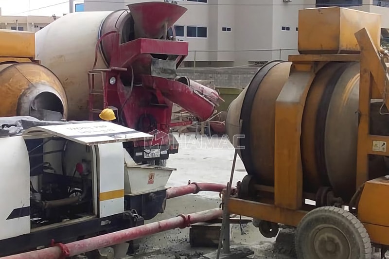 Diesel concrete mixer works together with trailer concrete pump photo